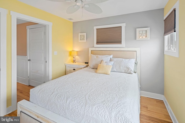 bedroom featuring ceiling fan and light hardwood / wood-style flooring