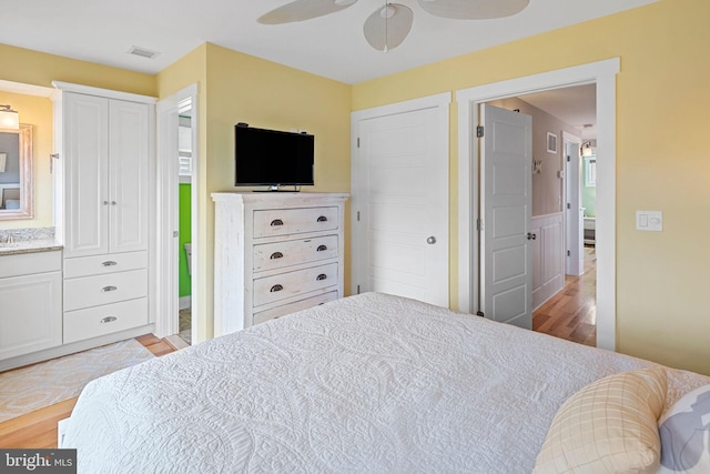 bedroom featuring ceiling fan and light hardwood / wood-style flooring