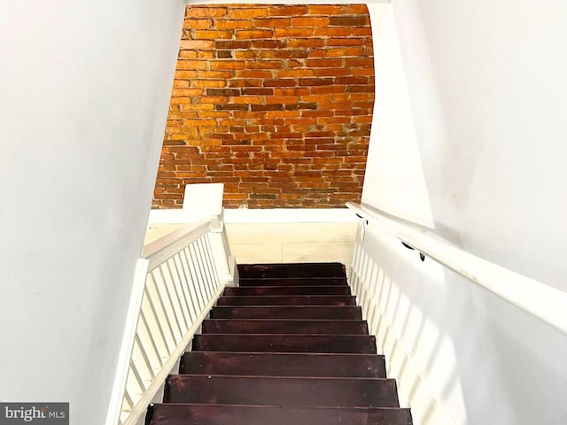 stairway with brick wall