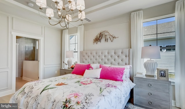 bedroom with an inviting chandelier