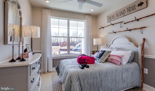 bedroom with multiple windows and ceiling fan