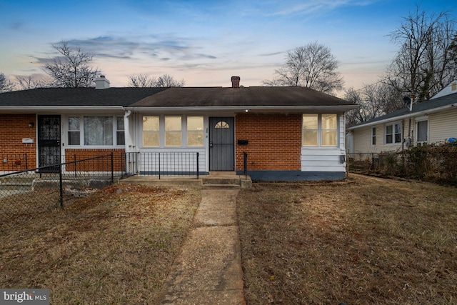 view of front of home featuring a yard