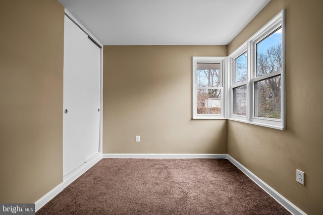 unfurnished bedroom with carpet floors and a closet