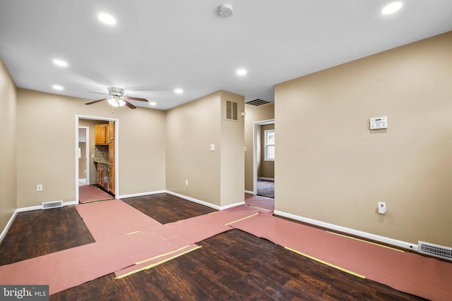 empty room with wood-type flooring and ceiling fan