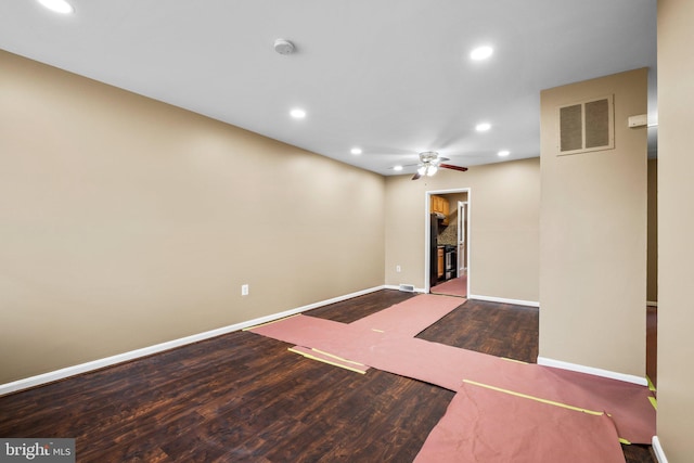 empty room featuring wood-type flooring and ceiling fan