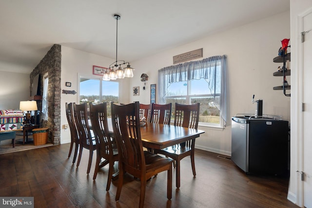 dining room with dark hardwood / wood-style floors