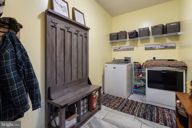 washroom featuring washing machine and dryer