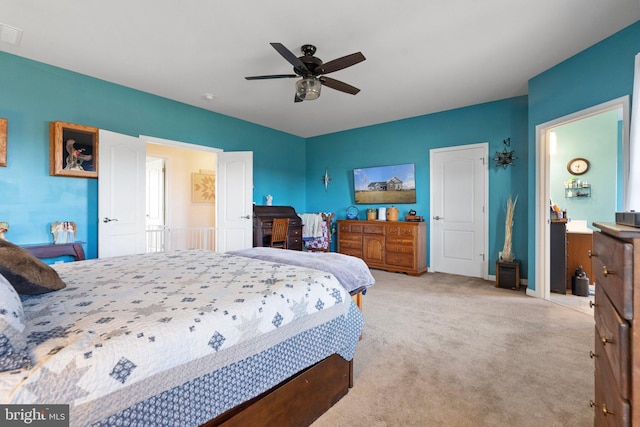 carpeted bedroom with ceiling fan