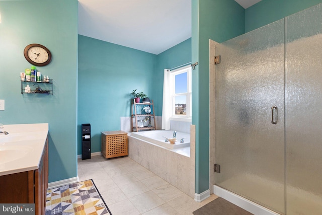 bathroom with independent shower and bath, vanity, and tile patterned floors