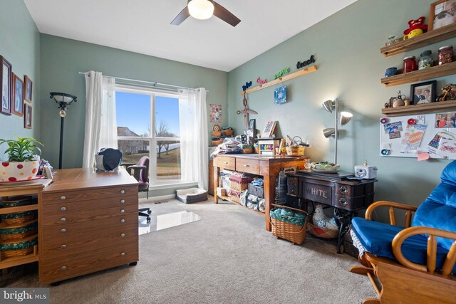 office space with ceiling fan and carpet flooring