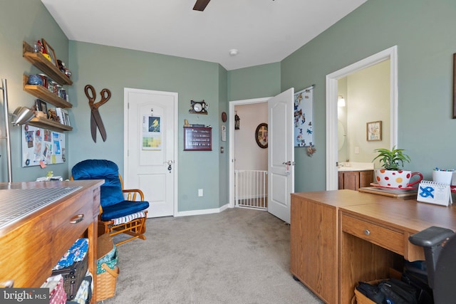 office with light carpet and ceiling fan