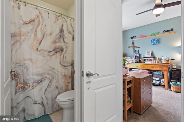 bathroom featuring ceiling fan and toilet