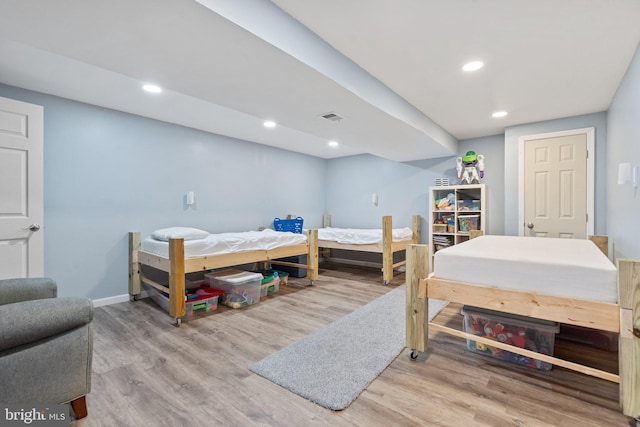 bedroom with light hardwood / wood-style floors