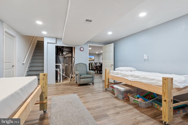 bedroom with light hardwood / wood-style floors