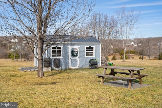 view of outdoor structure with a yard