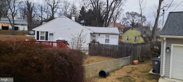 view of property exterior with a garage