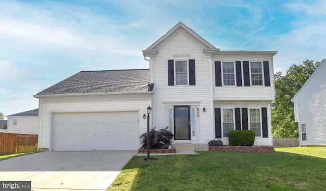 view of front of home featuring a garage and a front lawn