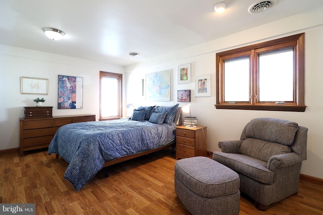 bedroom featuring dark hardwood / wood-style flooring