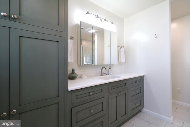 bathroom with tile patterned floors and vanity