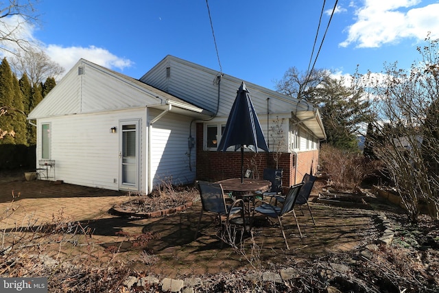 rear view of house featuring a patio