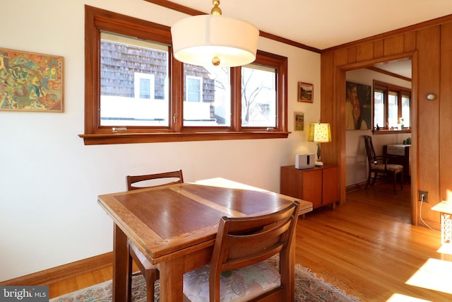 dining room featuring crown molding and wood-type flooring