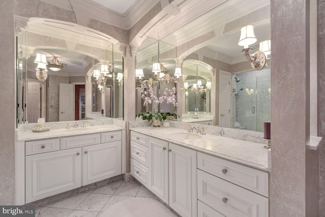 bathroom with crown molding, vanity, and a shower with shower door