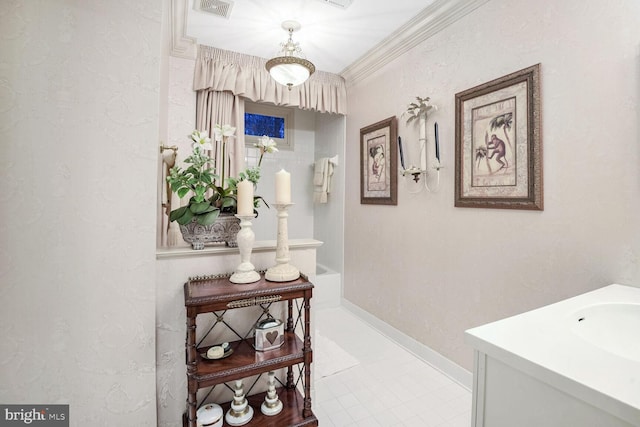 corridor featuring ornamental molding and sink