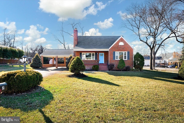 view of front of house featuring a front lawn and a carport