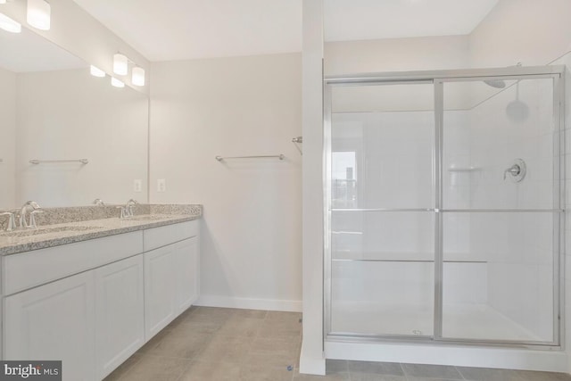 bathroom with vanity, tile patterned floors, and walk in shower