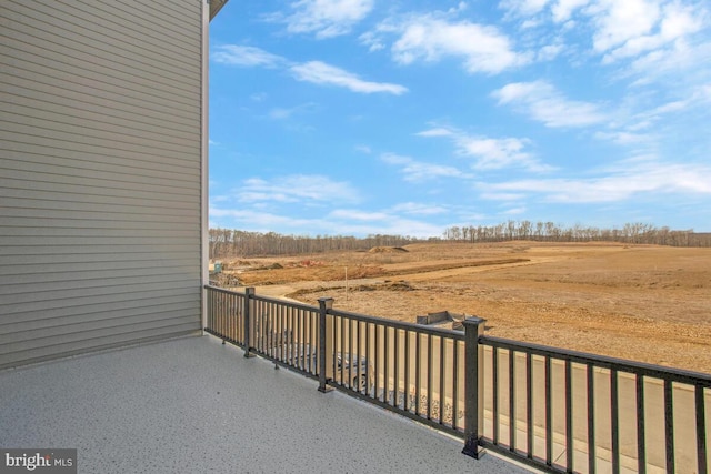 balcony featuring a rural view