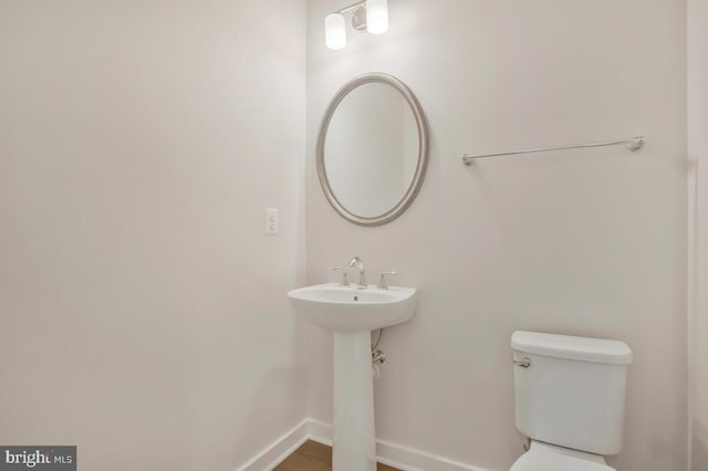 bathroom with toilet and sink