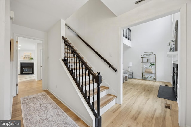 stairs featuring hardwood / wood-style flooring