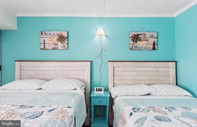 bedroom with ornamental molding