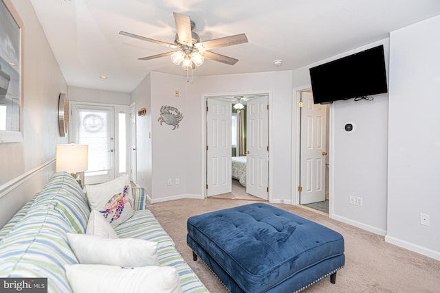 living room with light colored carpet and ceiling fan