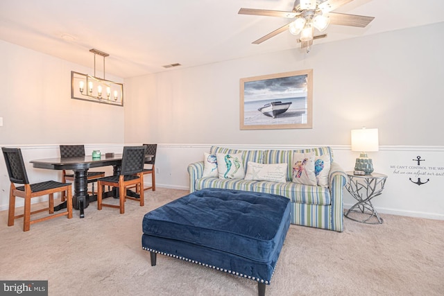 carpeted bedroom with an inviting chandelier