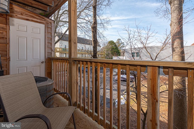 wooden balcony featuring central AC and a deck