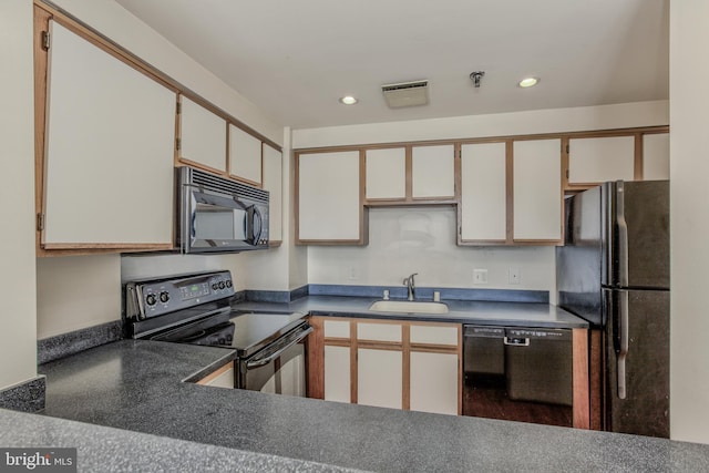 kitchen with white cabinets, sink, and black appliances