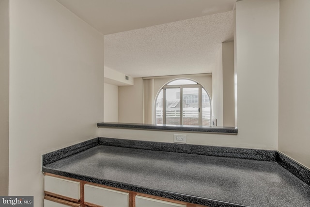 bathroom with a textured ceiling