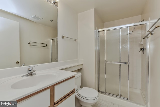 bathroom with walk in shower, vanity, toilet, and tile patterned flooring