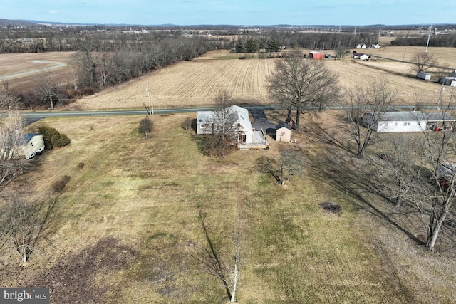 birds eye view of property featuring a rural view