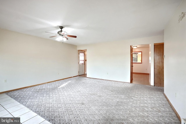 carpeted empty room featuring ceiling fan