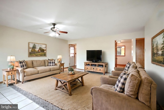 living room featuring light tile patterned floors and ceiling fan