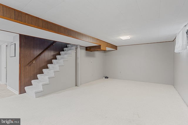 basement featuring light colored carpet