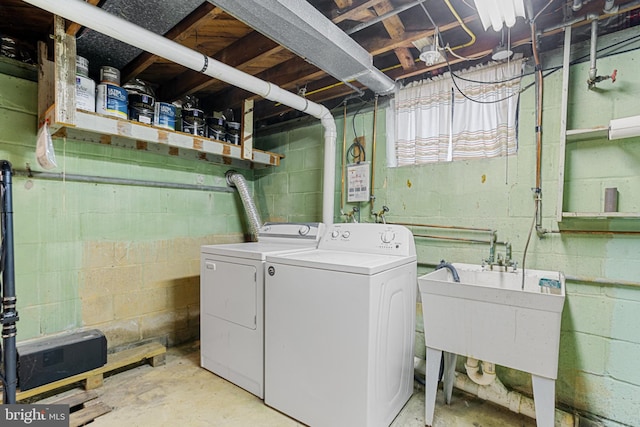 washroom with sink and washer and dryer