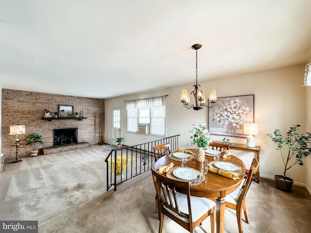 dining room featuring baseboards, cooling unit, carpet floors, a fireplace, and a notable chandelier