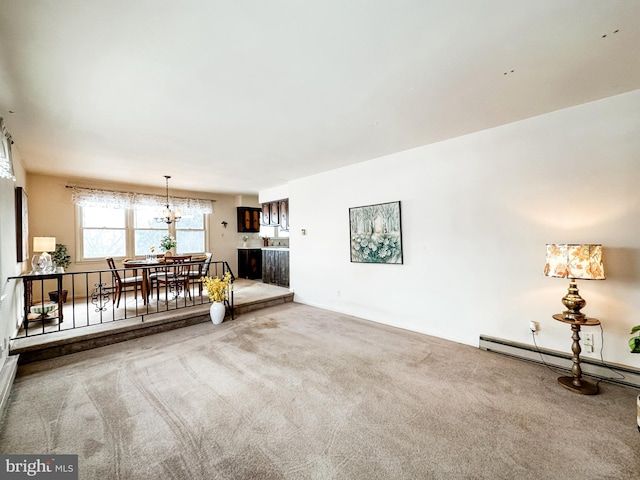 unfurnished living room with carpet floors and a baseboard radiator