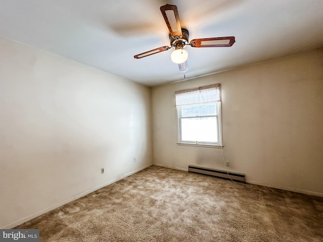 empty room featuring a baseboard heating unit, carpet floors, and a ceiling fan