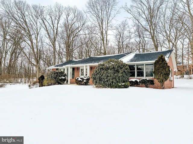 ranch-style house with brick siding