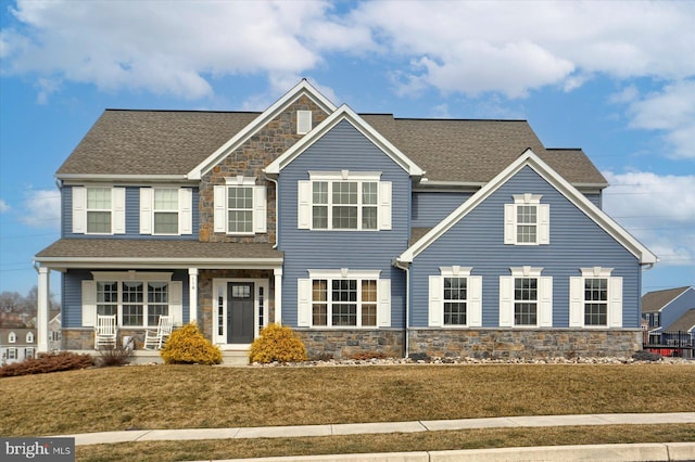 view of front of home featuring a porch and a front yard