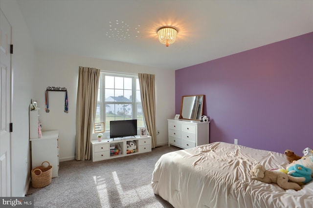 bedroom featuring light colored carpet